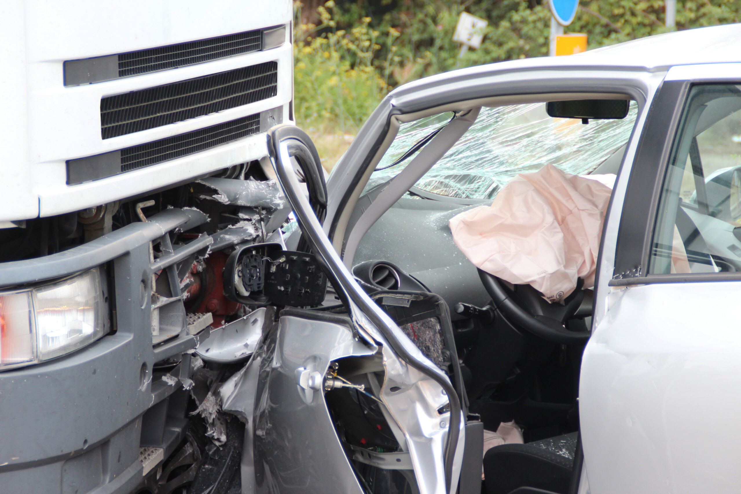 front-end collision between commercial truck and passenger vehicle